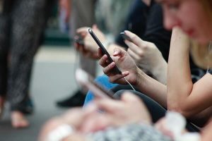 College student receiving alert from campus on their phone