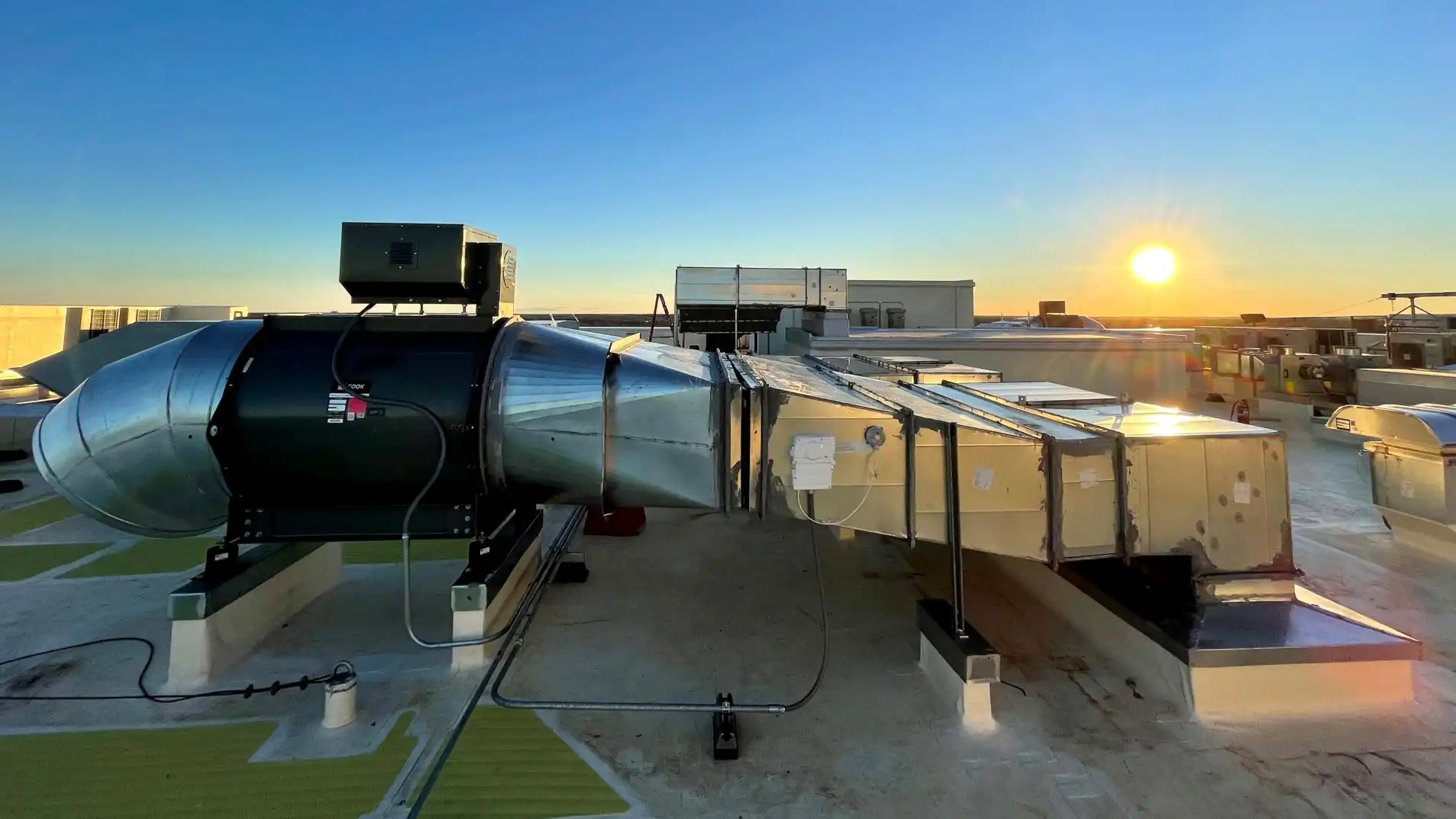 The exterior component of a smoke control system that rests on top of a building. It contains a fan and ducting that draws smoke out of the building in the event of a fire.